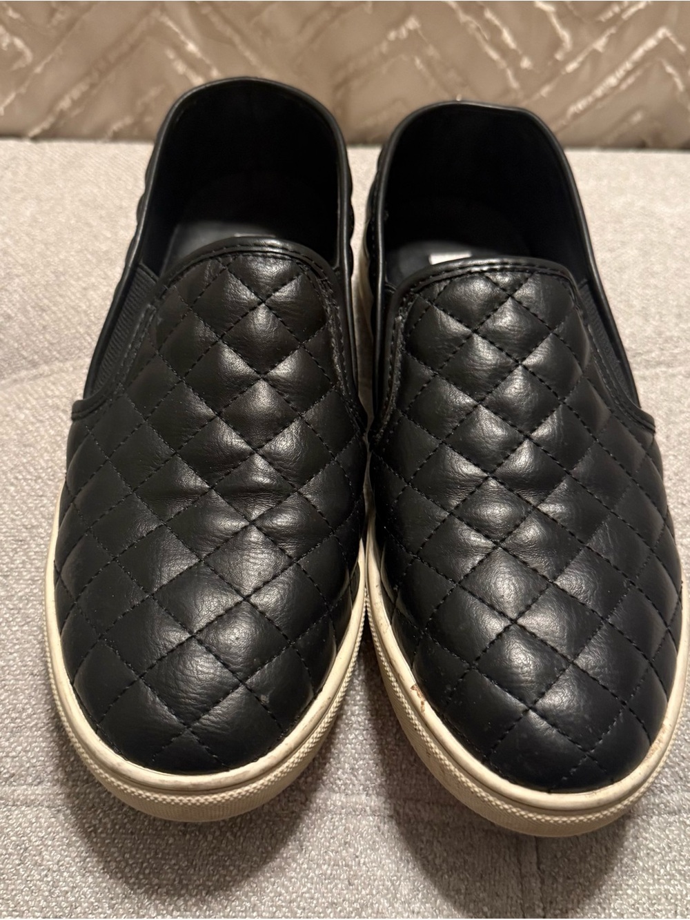 Steve Madden Women’s Black Quilted Slip-On Sneakers